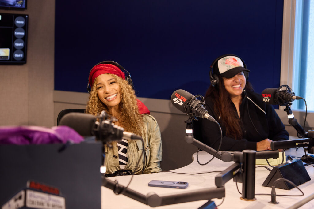 Kwanza Jones and Adai Lamar speaking during a Culture In Motion conversation at KJLH radio studio in Los Angeles